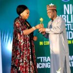Kogi ACReSALCoordinator recieving her award